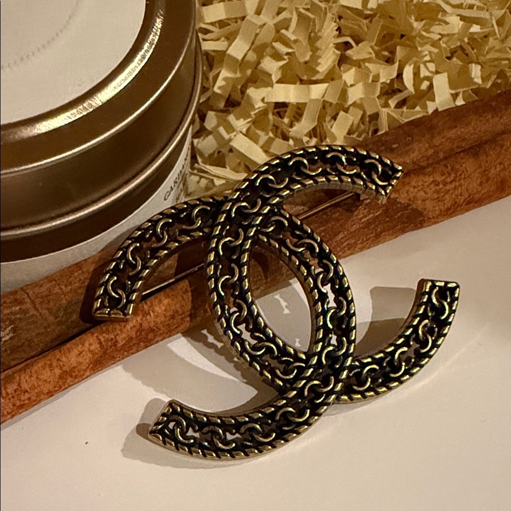 Gold and Black Brooch